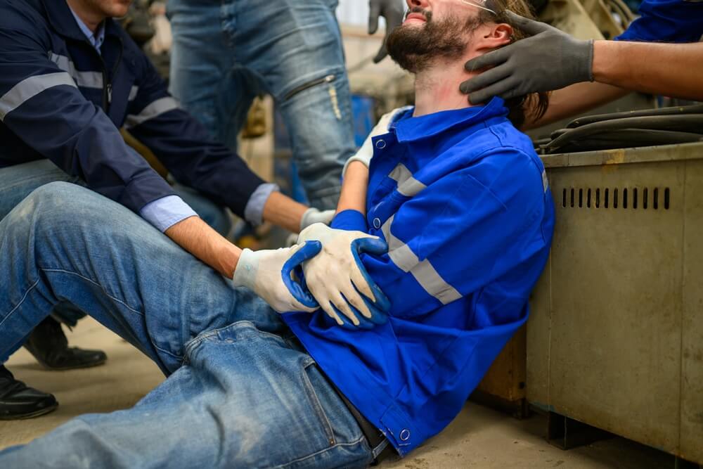 Industrial Accident worker with accident from machine factory
