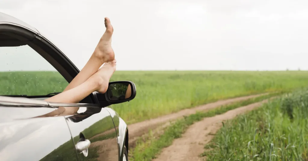 feet-out-car-window.